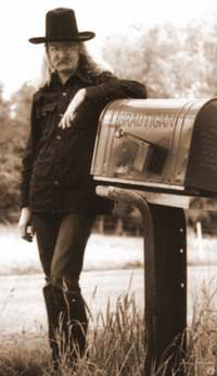 Richard Brautigan standing at his mailbox in Pine Creek