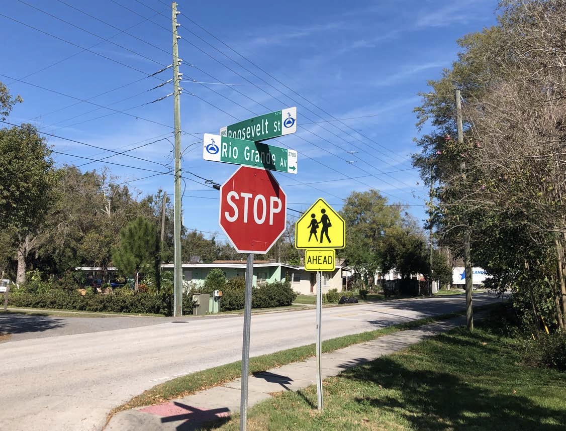 A stop sign on the side of a road.